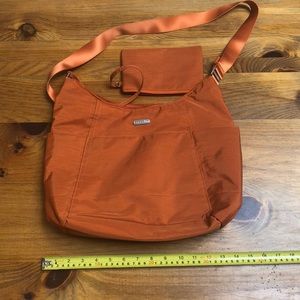Baggallini orange crossbody or travel bag